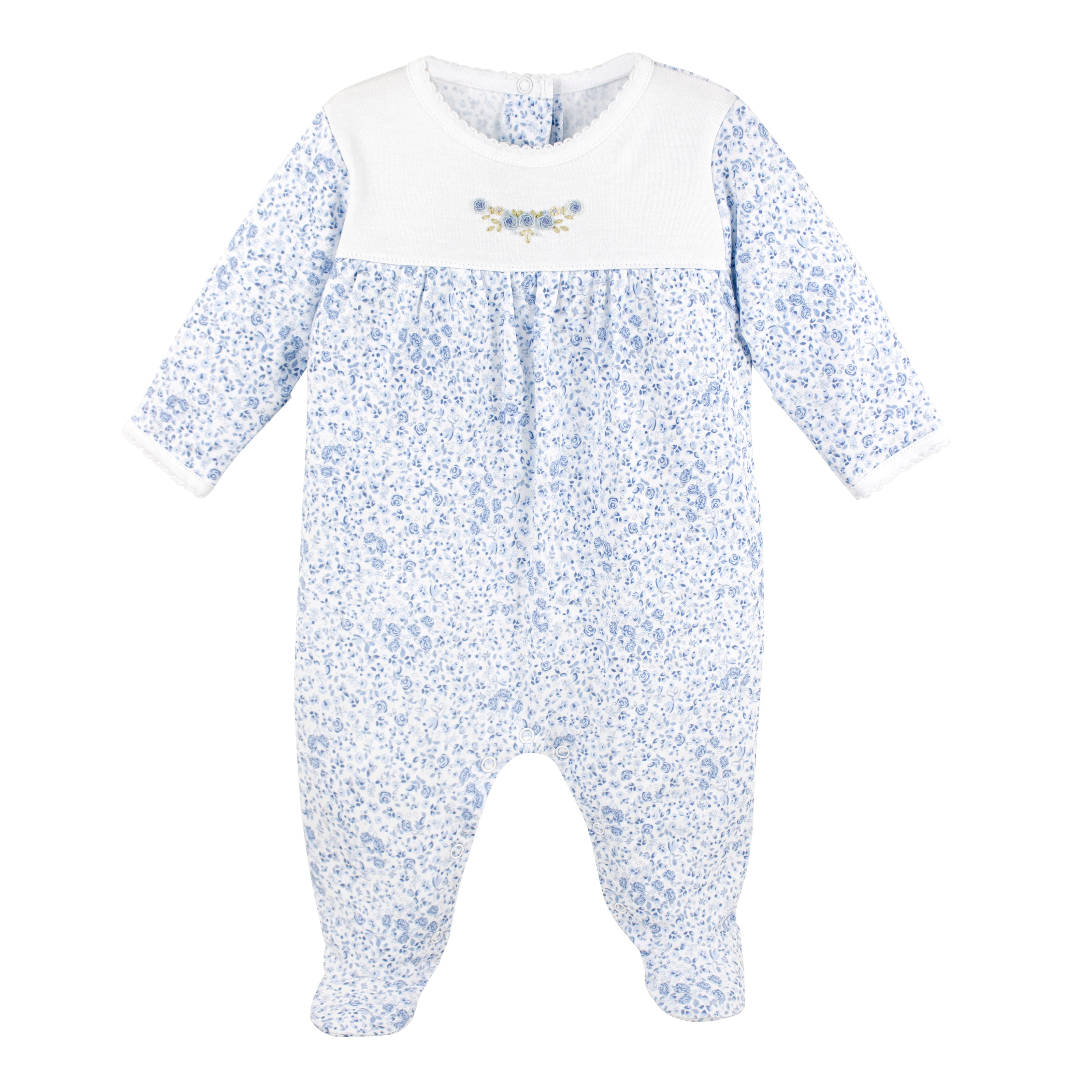Baby girl zipper footie in Peruvian Pima cotton with delicate blue rose print and hand-embroidered floral detail on the chest — soft, elegant, and perfect for sensitive s