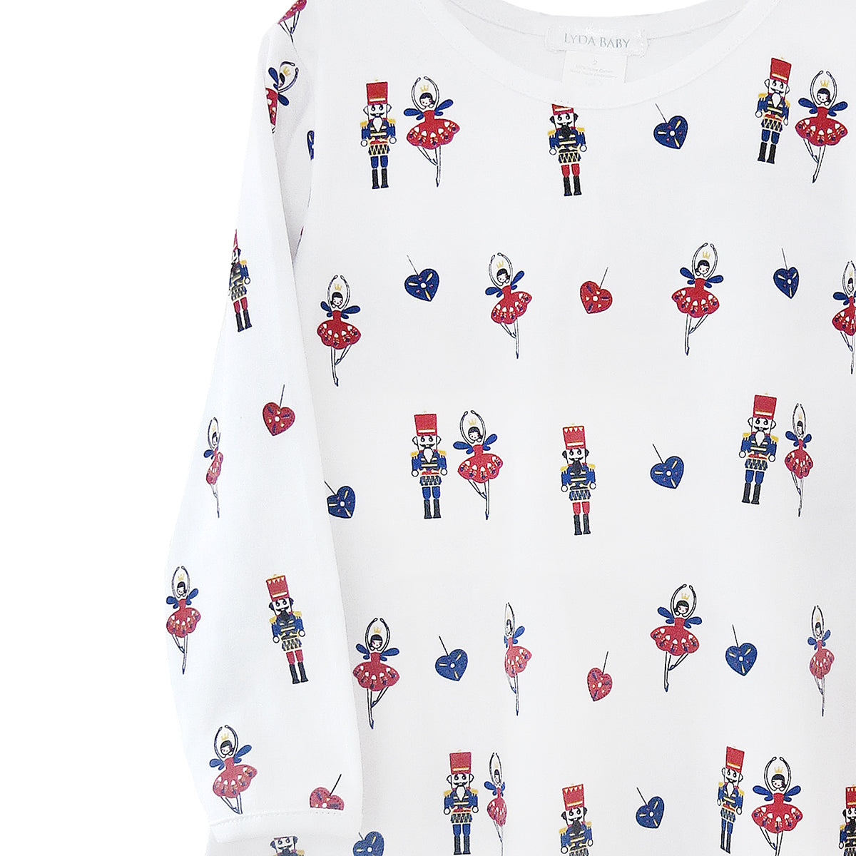 Girl’s Christmas dress in Peruvian Pima cotton, long sleeves and flared skirt with festive nutcracker and ballerina print.