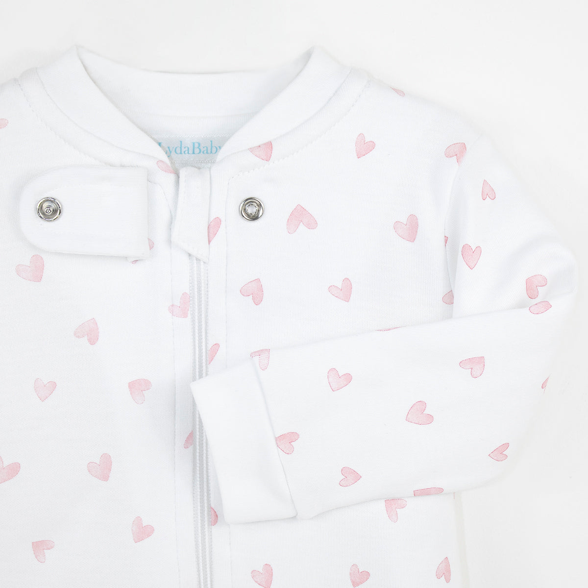 Cheerful baby girl zipper printed with festive hearts on premium Peruvian Pima cotton — soft, breathable, and skin-friendly.