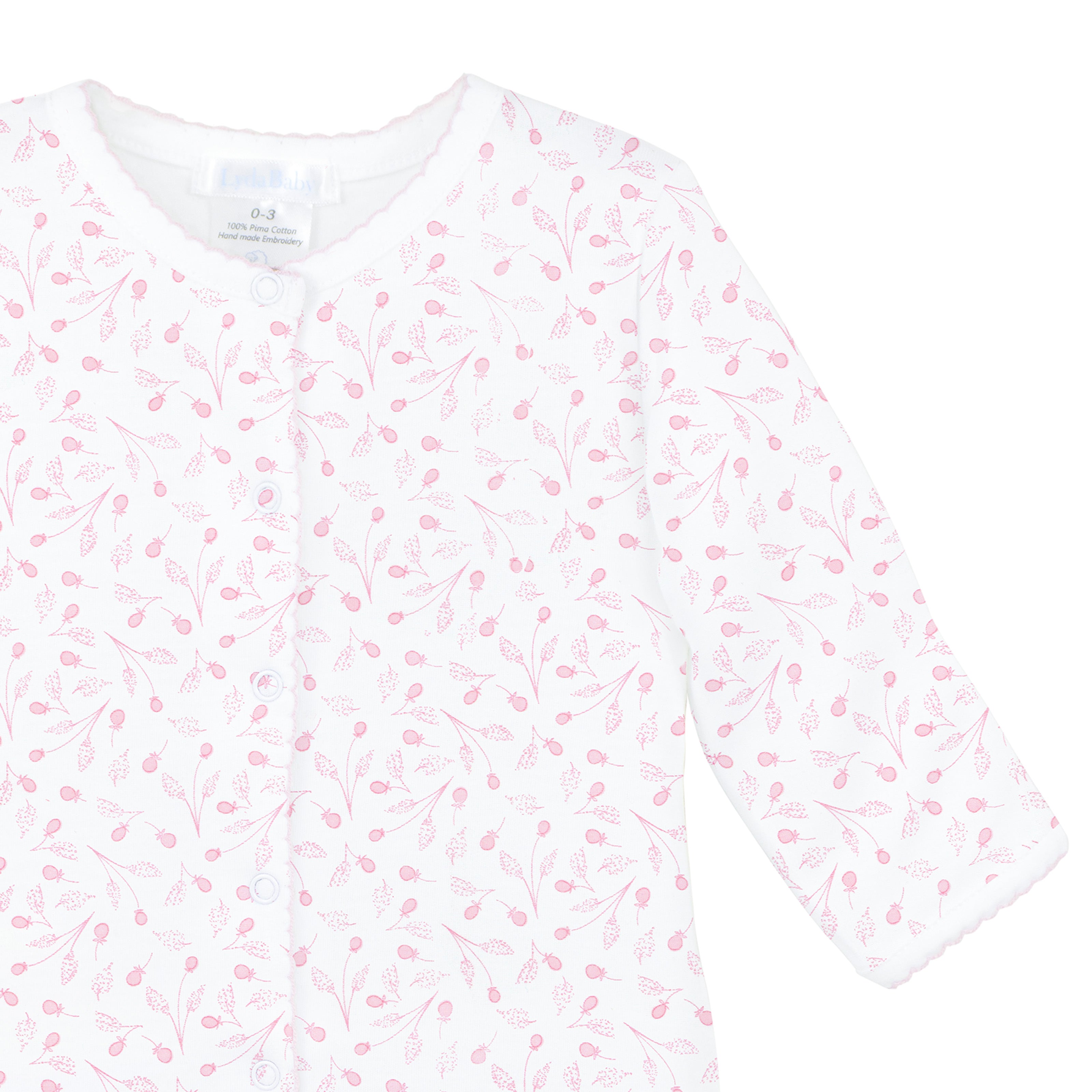 Baby girl footie with delicate pink fruit print throughout the garment, crafted from ultra-soft Peruvian Pima cotton for all-day comfort.