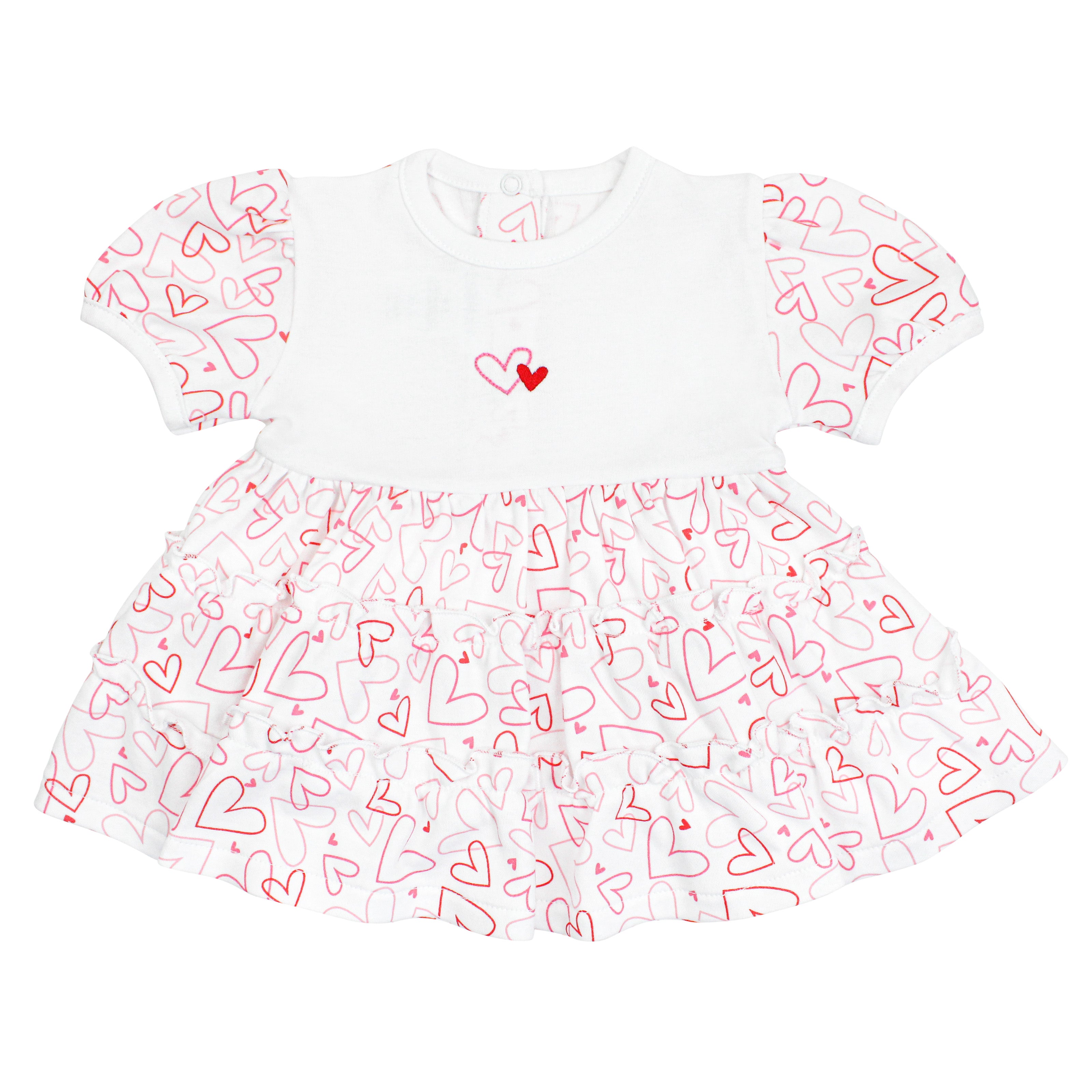 Baby girl dress with doodle hearts print, white chest panel with hand-embroidered double hearts, and short sleeves — made from soft, breathable Peruvian Pima cotton for everyday elegance.