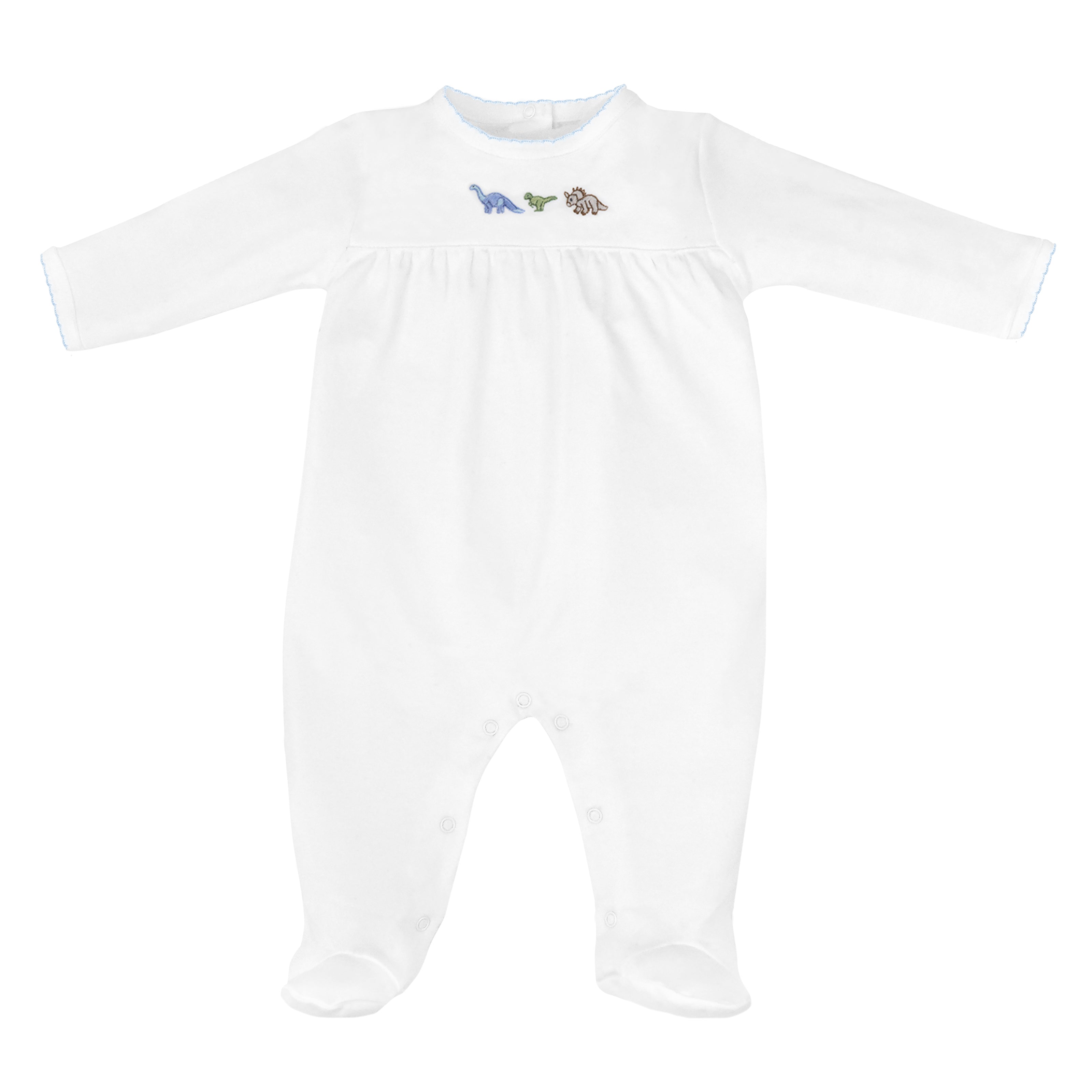 Baby boy footie in Peruvian Pima cotton with hand-embroidered dinosaurs and chest ruffle detail — cozy and gentle for sensitive skin.