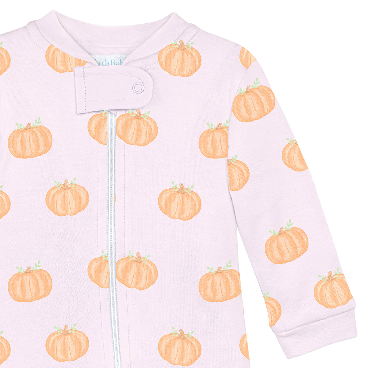Luxury baby girl footie in pink Peruvian Pima cotton with orange pumpkin print, breathable and hypoallergenic newborn outfit.