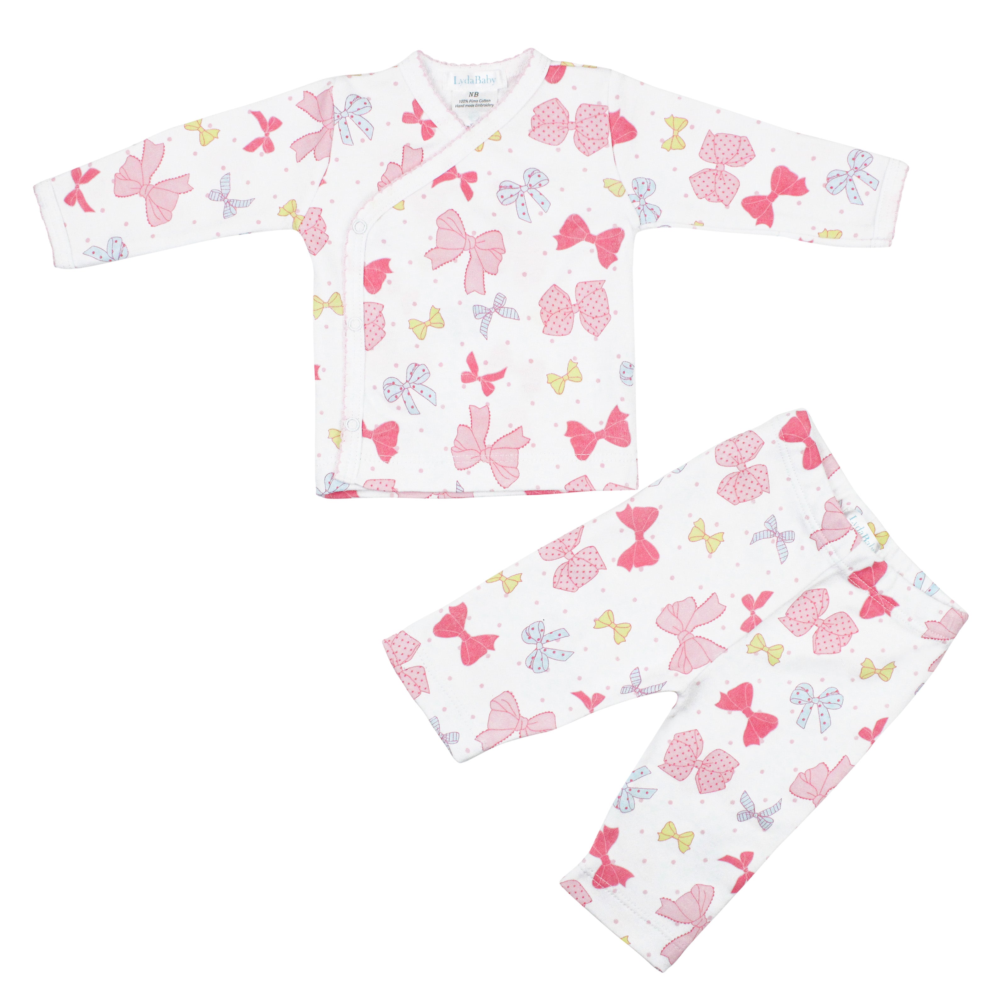 Baby girl two-piece pajama set with crossover long-sleeve top and pants, made from premium Peruvian Pima cotton with delicate ribbon print — ultra-soft and stylish.