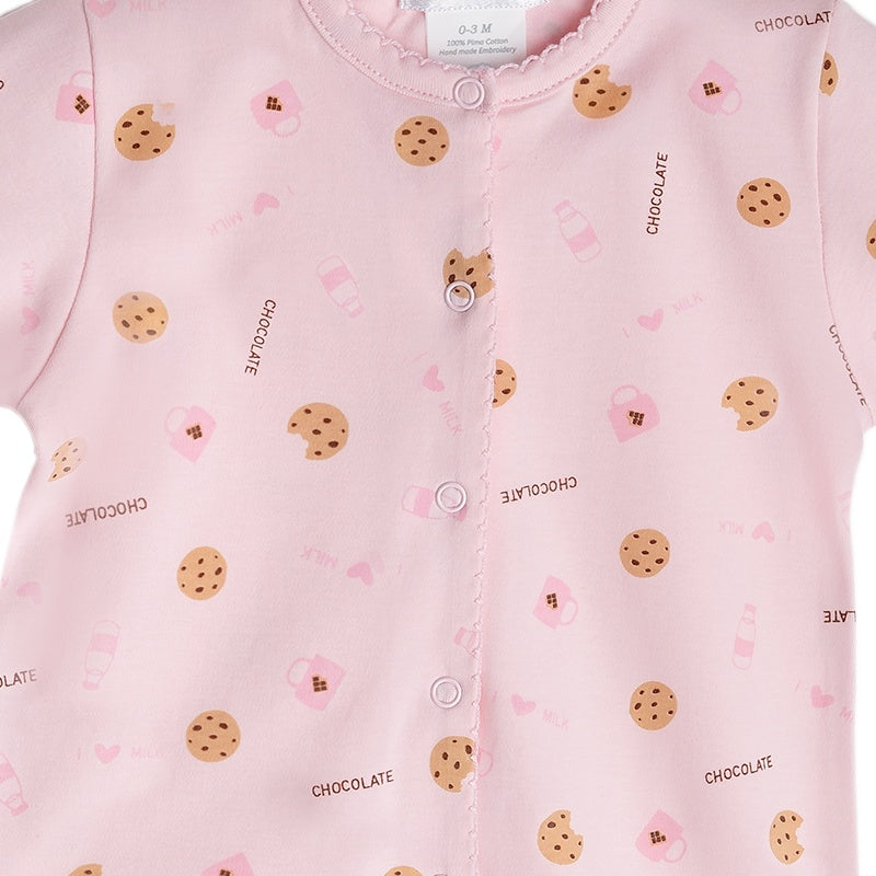 Pink pima cotton baby footie with cookies print - close up