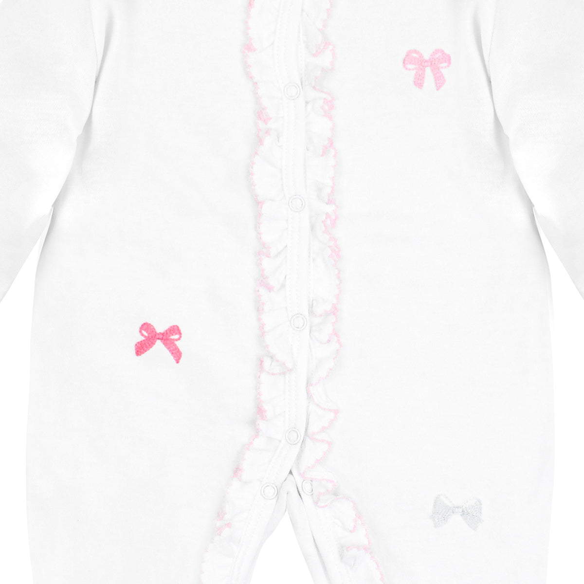 White baby footie with pink crochet trim, ruffled collar, and embroidered ribbons in pink, fuchsia, and white.