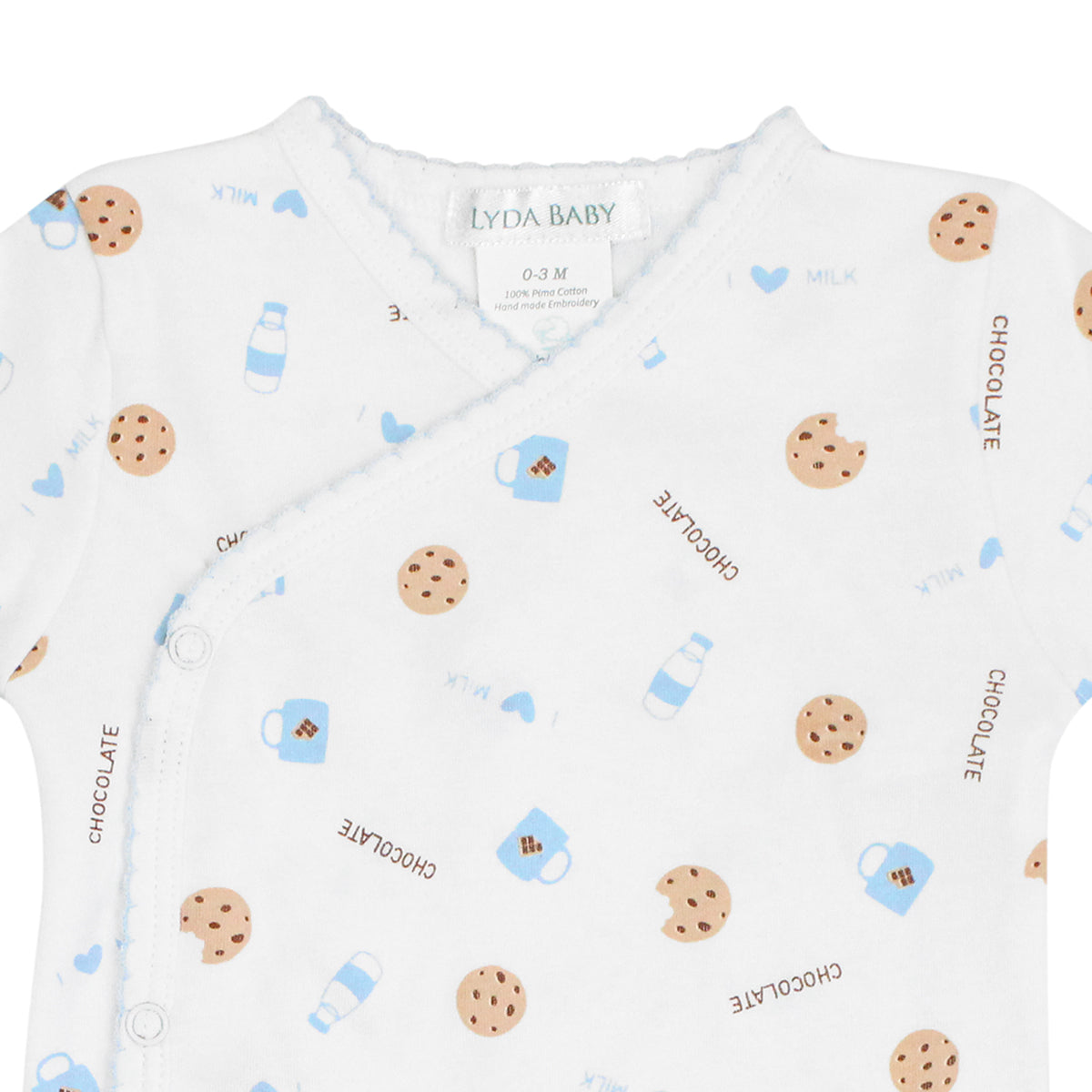 Luxury Peruvian Pima cotton two-piece pajamas for baby boys, featuring crossover snap top and pants with chocolate chip cookie and milk mug print — playful and breathable sleepwear.