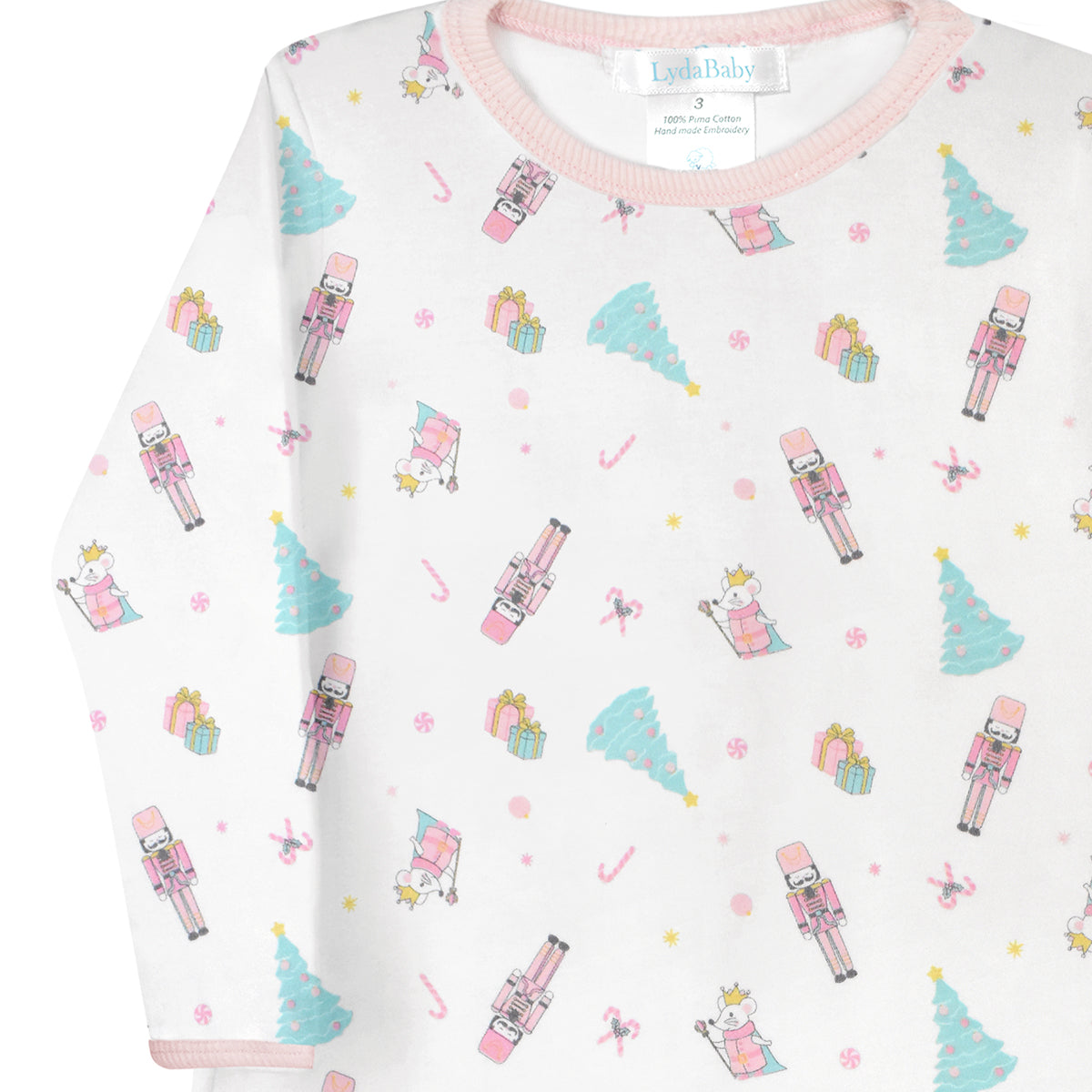 Luxury baby girl Christmas dress crafted in soft Peruvian Pima cotton, long sleeves, white with nutcracker, ballerina, Christmas tree and gift box print, elegant festive design.
