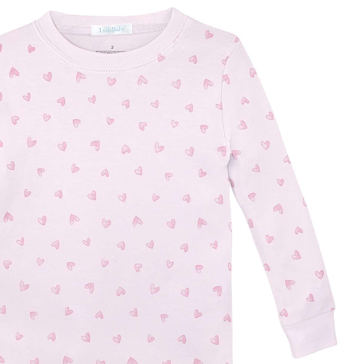 Pink two-piece pajama set for girls in Peruvian Pima cotton, with small red watercolor heart print on top and pants.