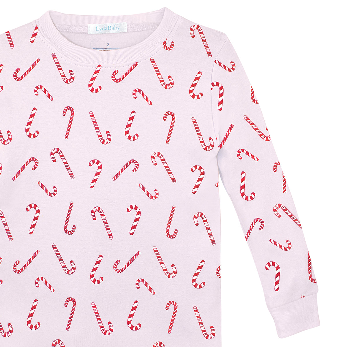 Pink two-piece Christmas pajama set for girls, made of Peruvian Pima cotton, with red candy cane print on top and pants.