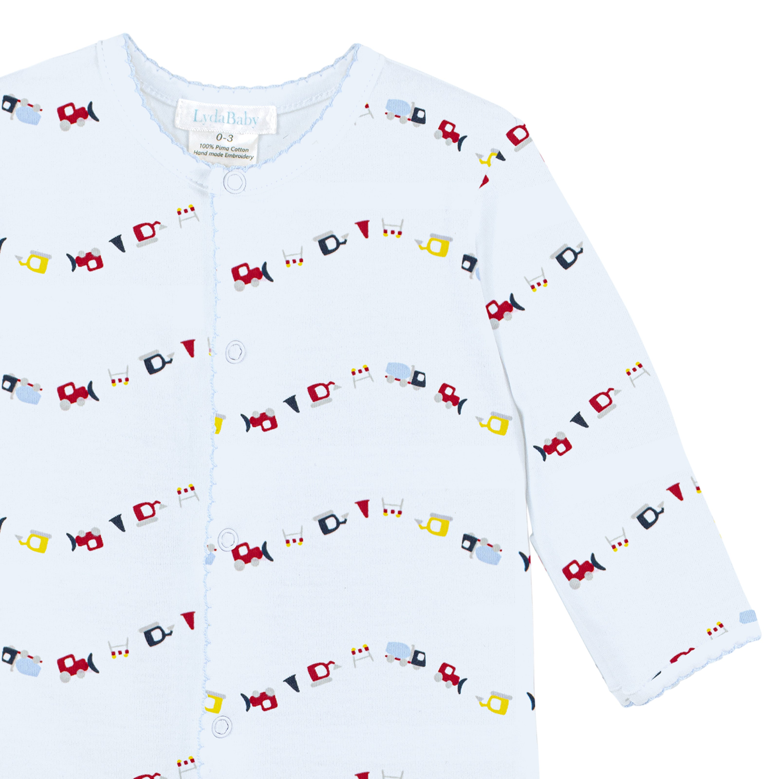 Blue newborn footie with colorful mini trucks print made from Peruvian Pima cotton baby boy clothes.