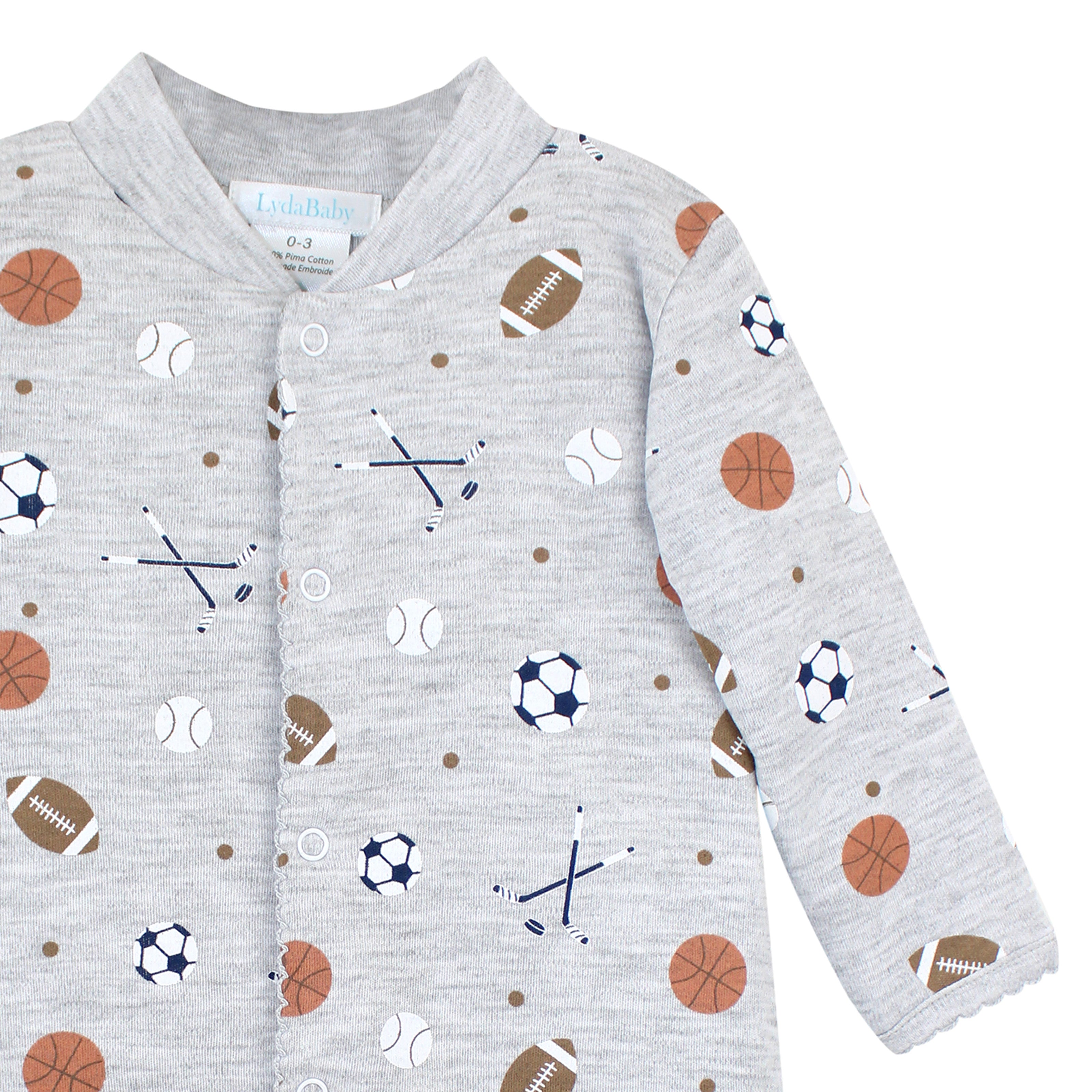 Gray baby boy footie with front snap buttons and playful sports balls print, made from ultra-soft Pima cotton.