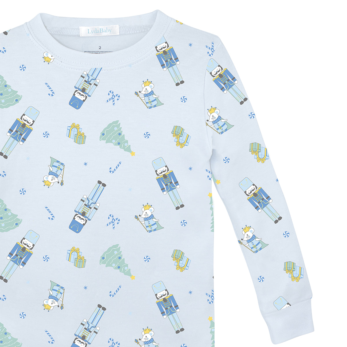 Light blue two-piece boys’ pajama set in Peruvian Pima cotton with festive nutcracker and Christmas tree print.