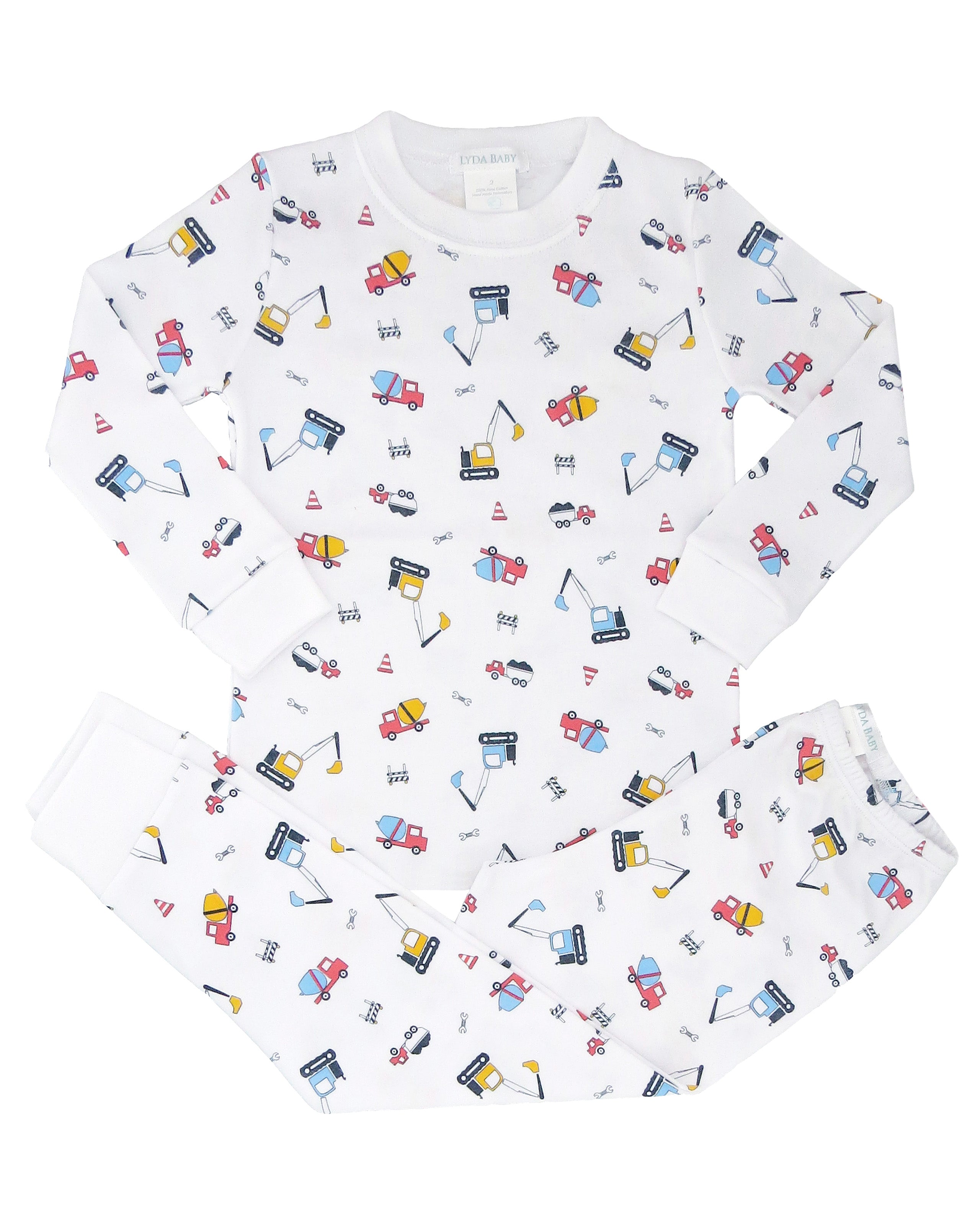 Soft baby boy pajama set in Peruvian Pima cotton with 'Kids construction' print — breathable and hypoallergenic luxury sleepwear from boutique baby clothing collections.