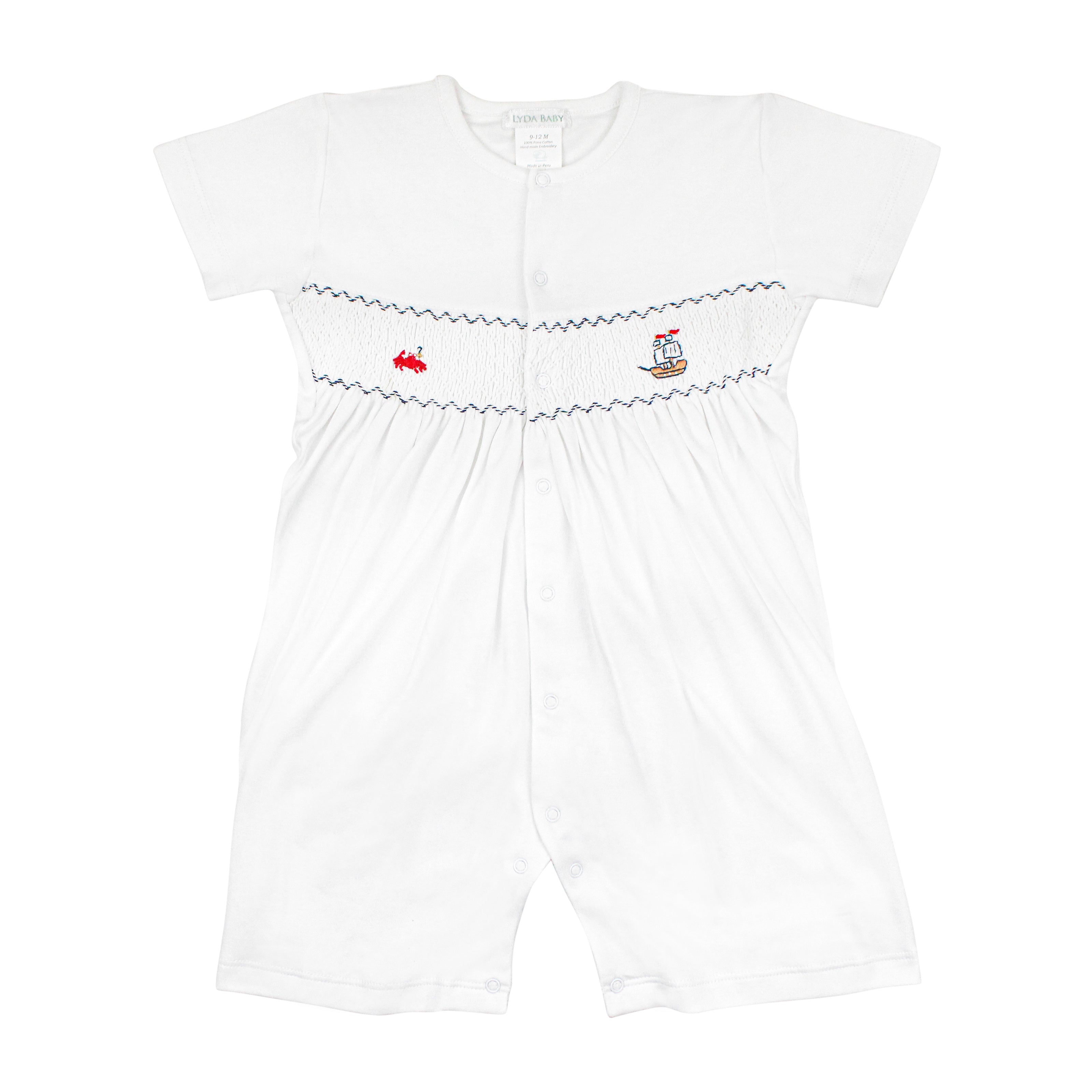 White baby romper with short sleeves, smock chest, embroidered red crab and pirate ship, snap closures.