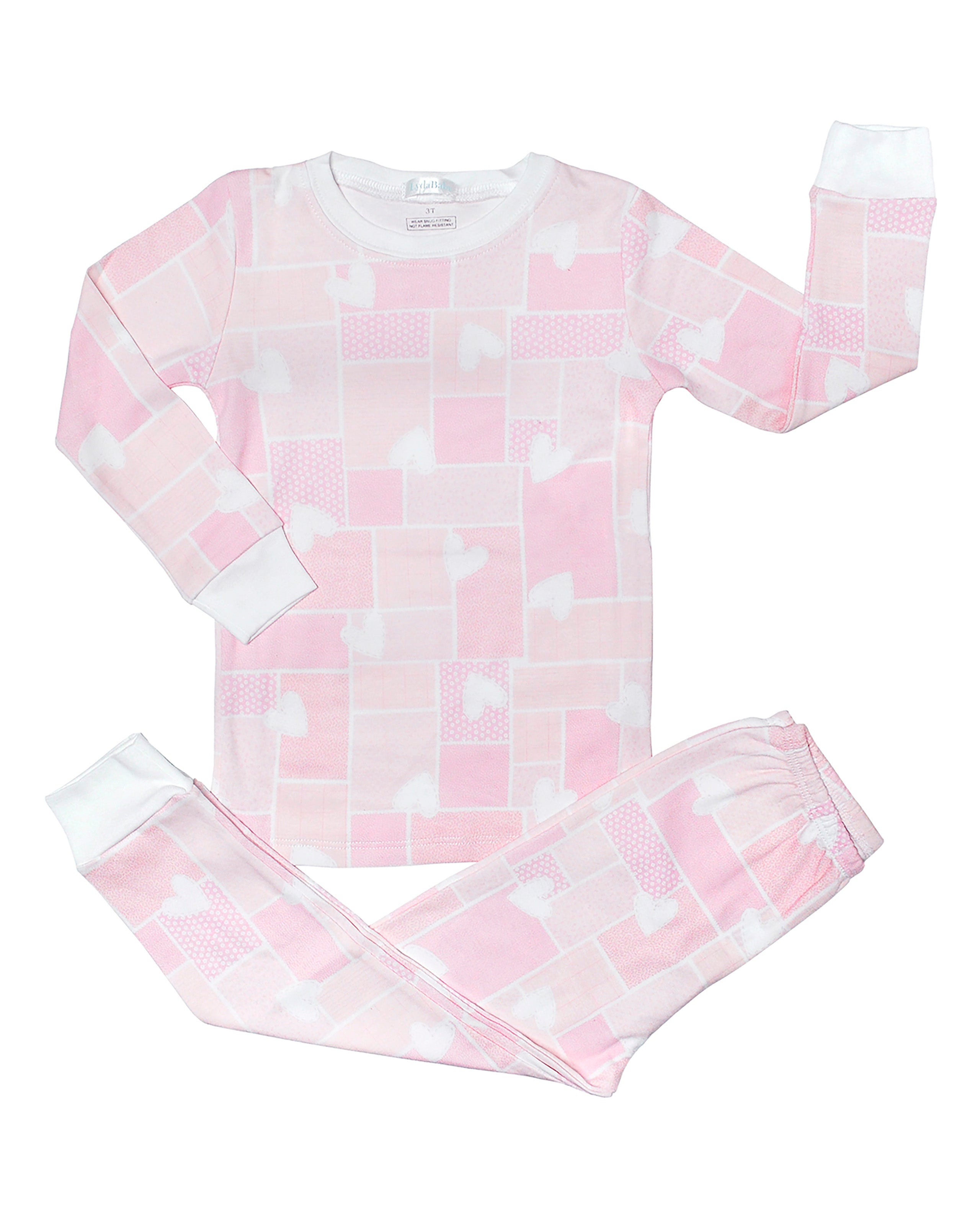 Soft baby girl pajama set in Peruvian Pima cotton with 'Hearts patch' print — breathable and hypoallergenic luxury sleepwear from boutique baby clothing collections.