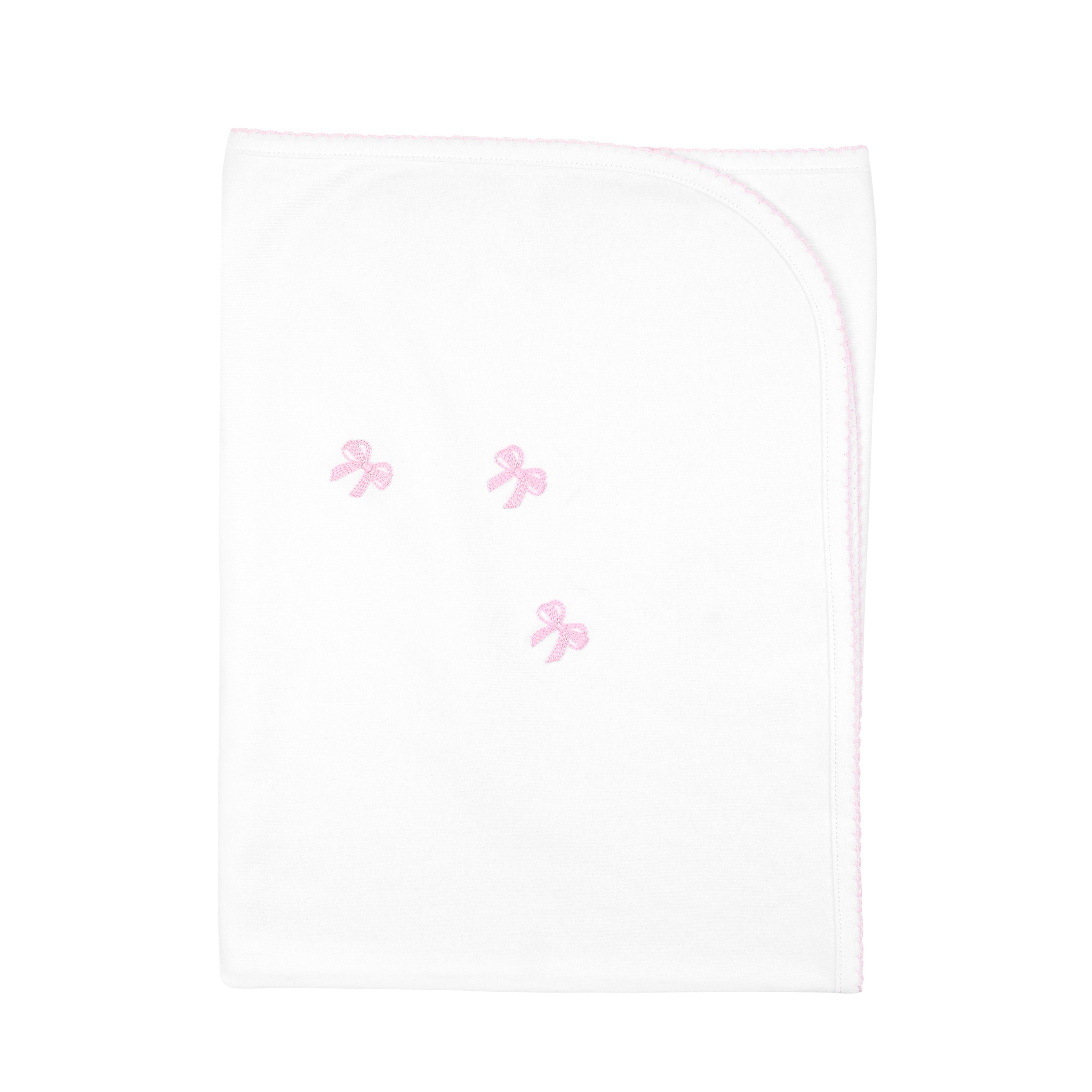  Elegant baby girl blanket with delicate striped bows hand-embroidered on Peruvian Pima cotton — soft, breathable, and made by artisans.
