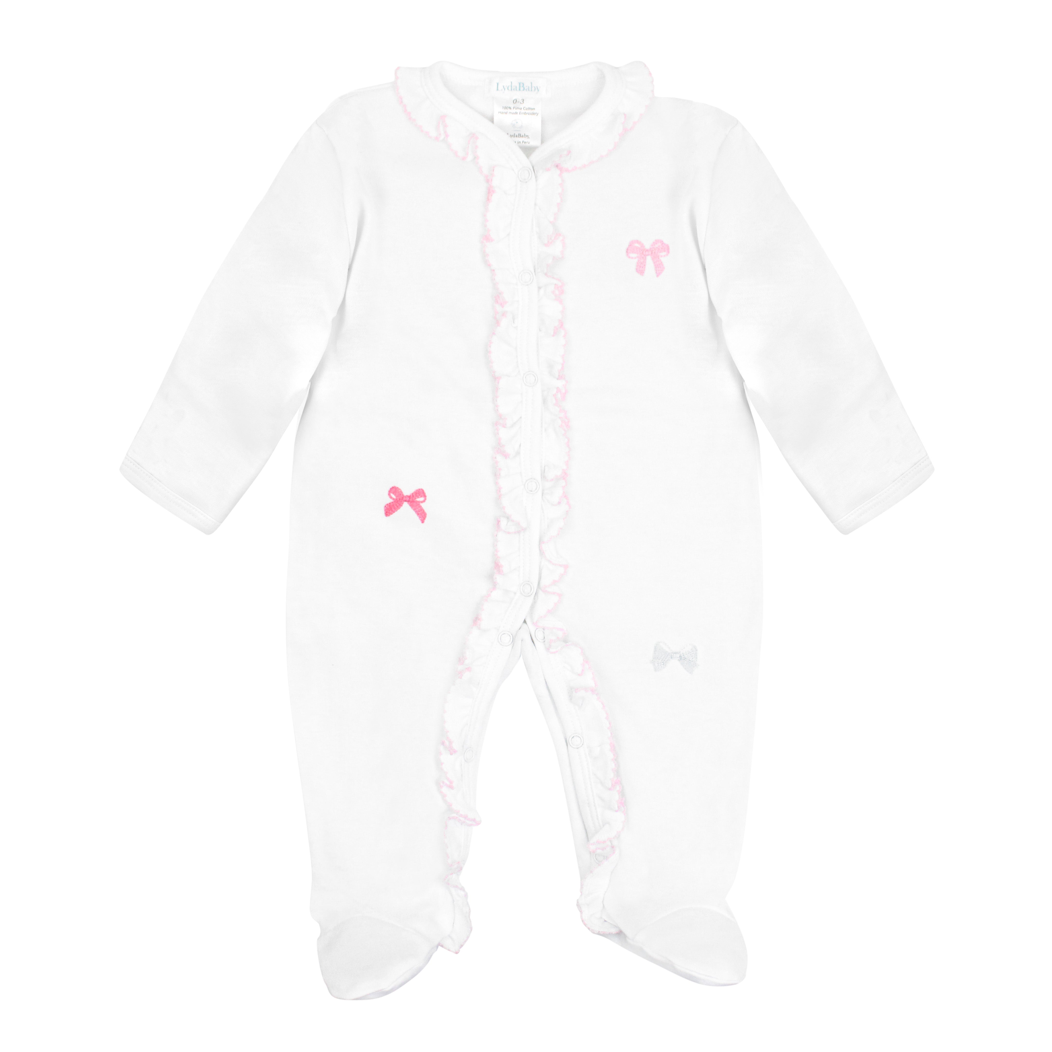 White baby footie with pink crochet trim, ruffled collar, and embroidered ribbons in pink, fuchsia, and white.