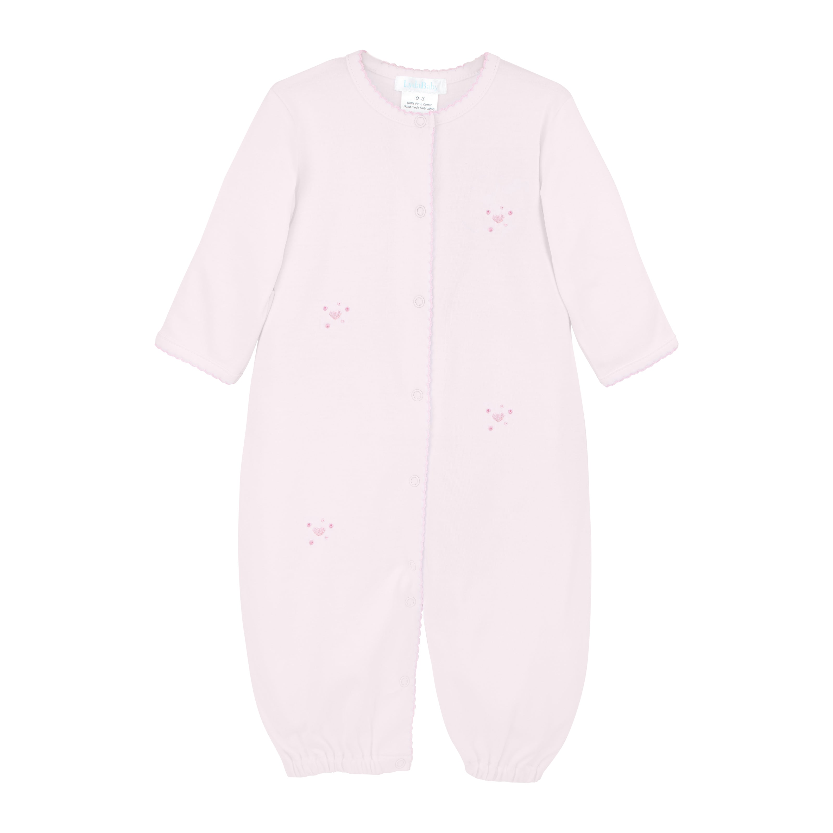  Delicate baby girl converter hand-embroidered with pink bubble hearts by skilled Peruvian artisans on premium Peruvian Pima cotton — soft, breathable, and gentle on baby skin.
