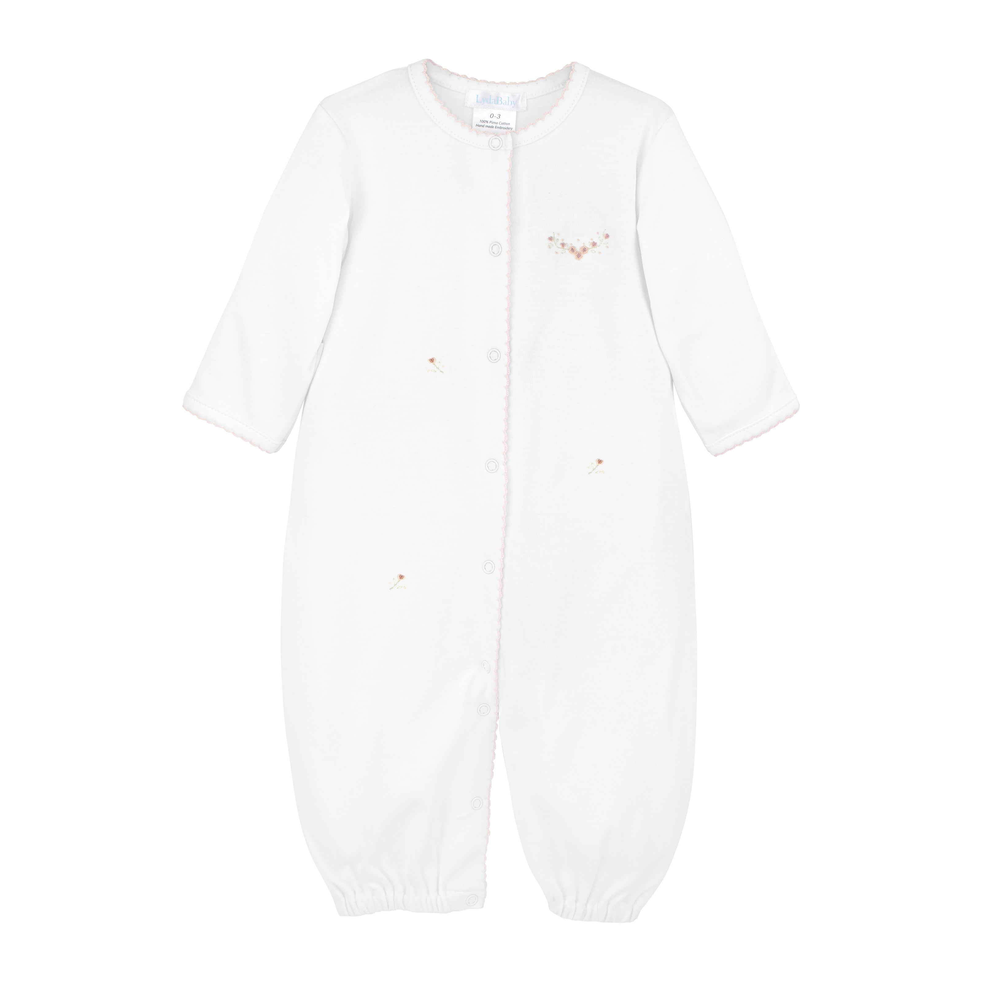  Elegant baby girl converter hand-embroidered with a beautiful roses garden motif by Peruvian artisans on soft, breathable Peruvian Pima cotton — luxurious and gentle for delicate skin.

