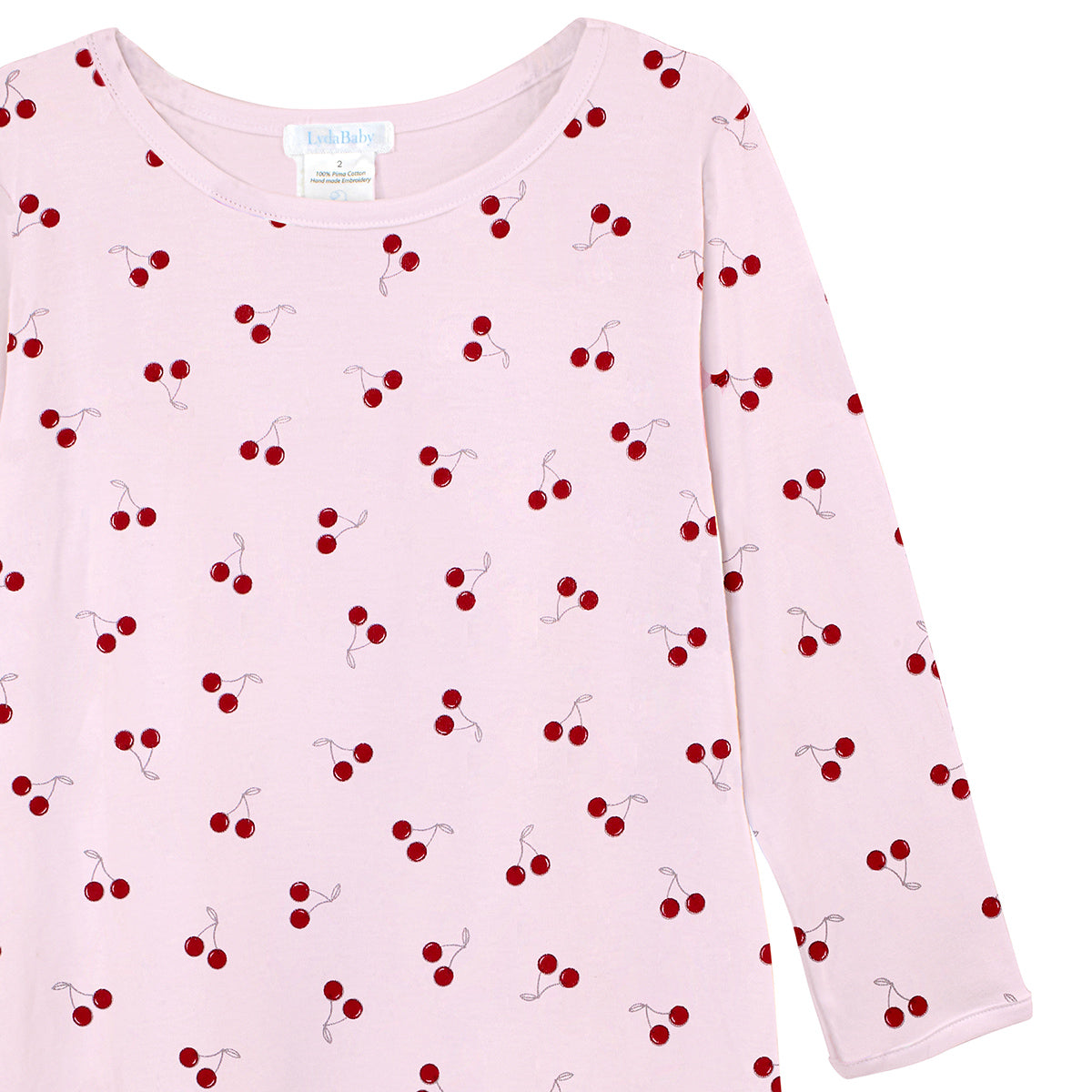 Luxury baby girl dress in pink Peruvian Pima cotton with all-over cherry print, soft and breathable newborn outfit.