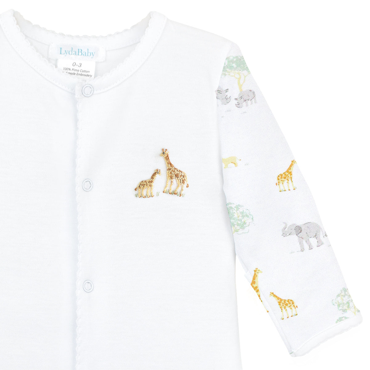 Unisex baby footie in premium Peruvian Pima cotton, with Safari Life print on sleeves and feet, and hand-embroidered safari animals on the chest — breathable, soft, and perfect for little explorers.