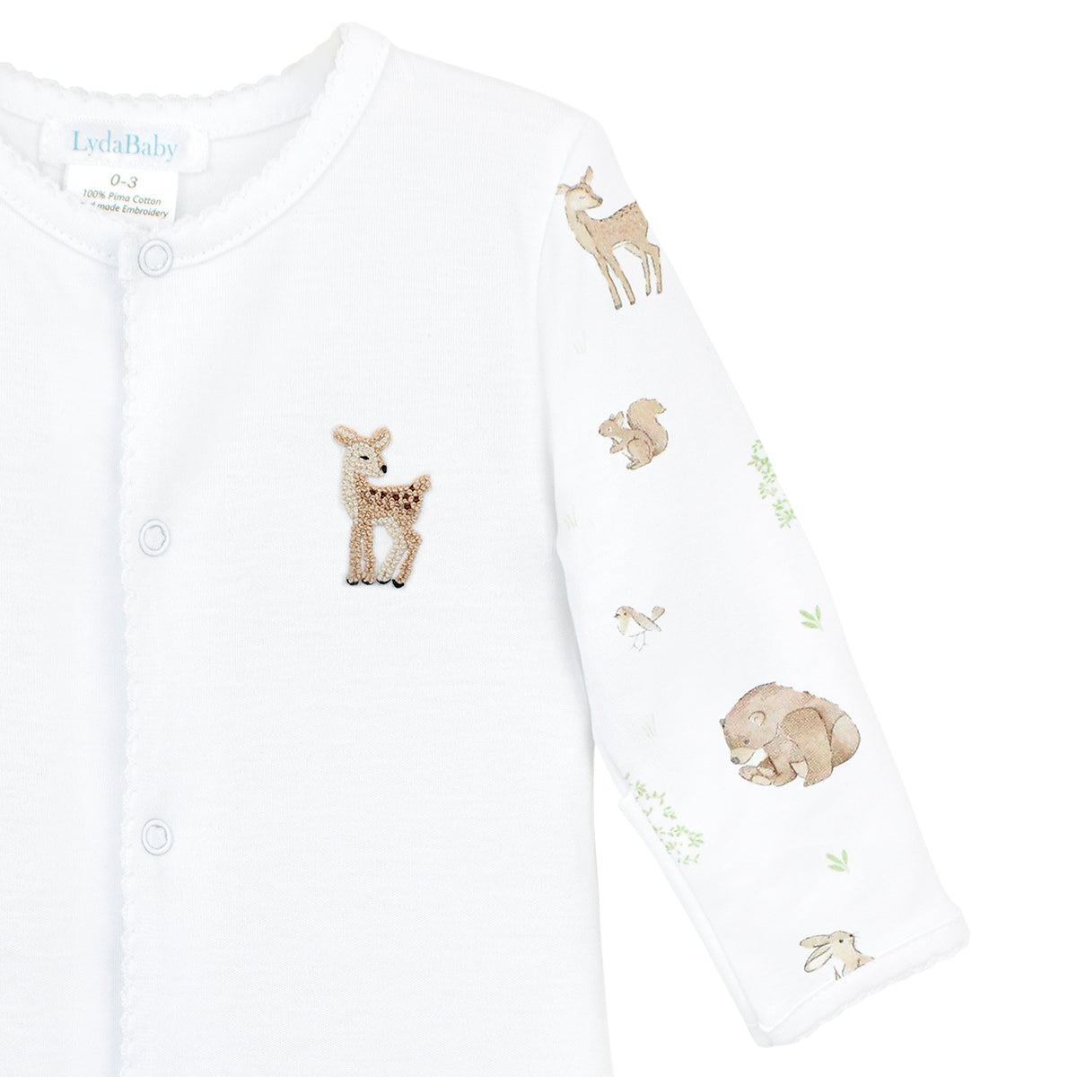 Unisex baby footie made from ultra-soft Peruvian Pima cotton, featuring woodland friends print on sleeves and feet, and hand-embroidered deer on the chest — breathable, cozy, and inspired by forest adventures.