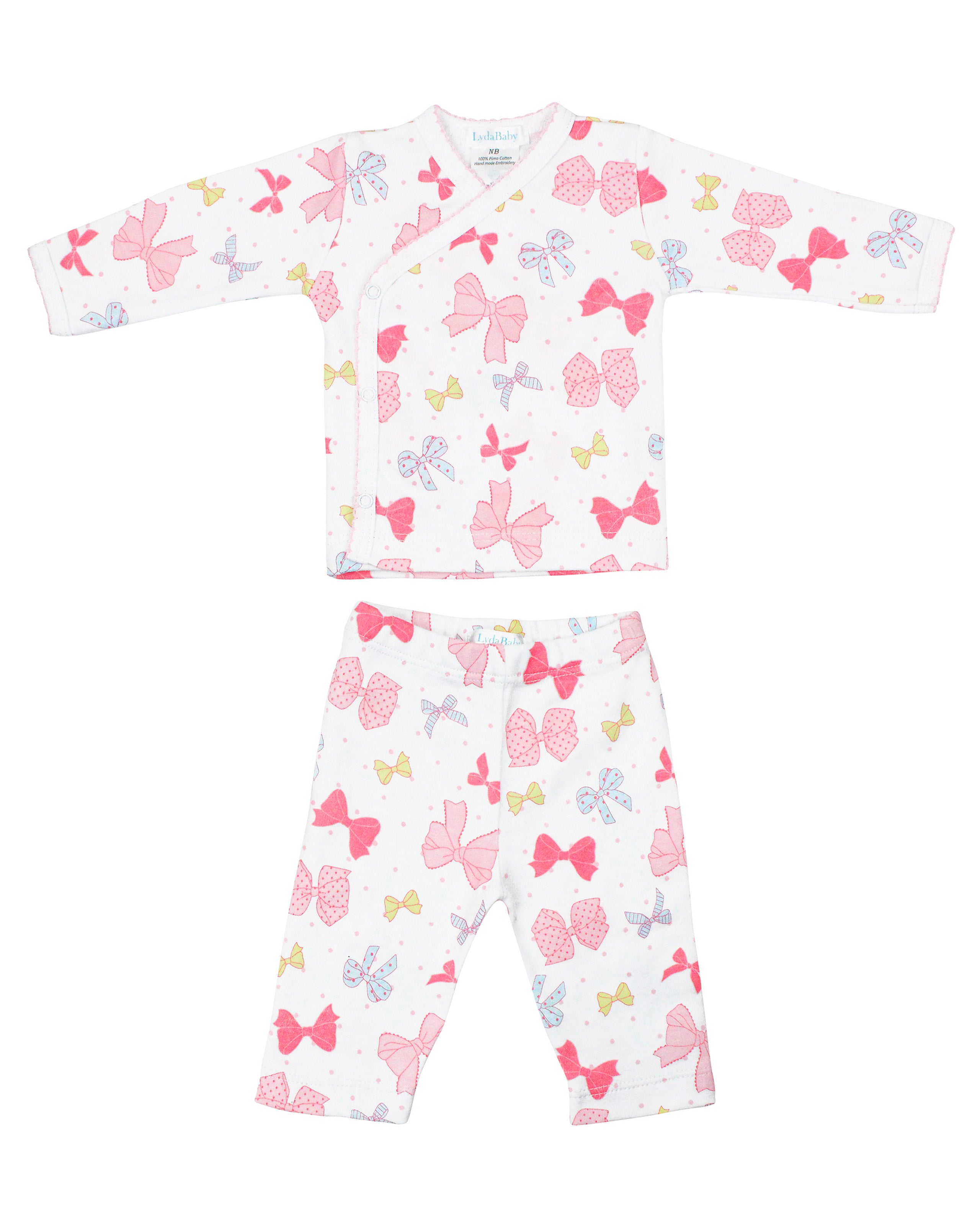 Baby girl two-piece pajama set with crossover long-sleeve top and pants, made from premium Peruvian Pima cotton with delicate ribbon print — ultra-soft and stylish.