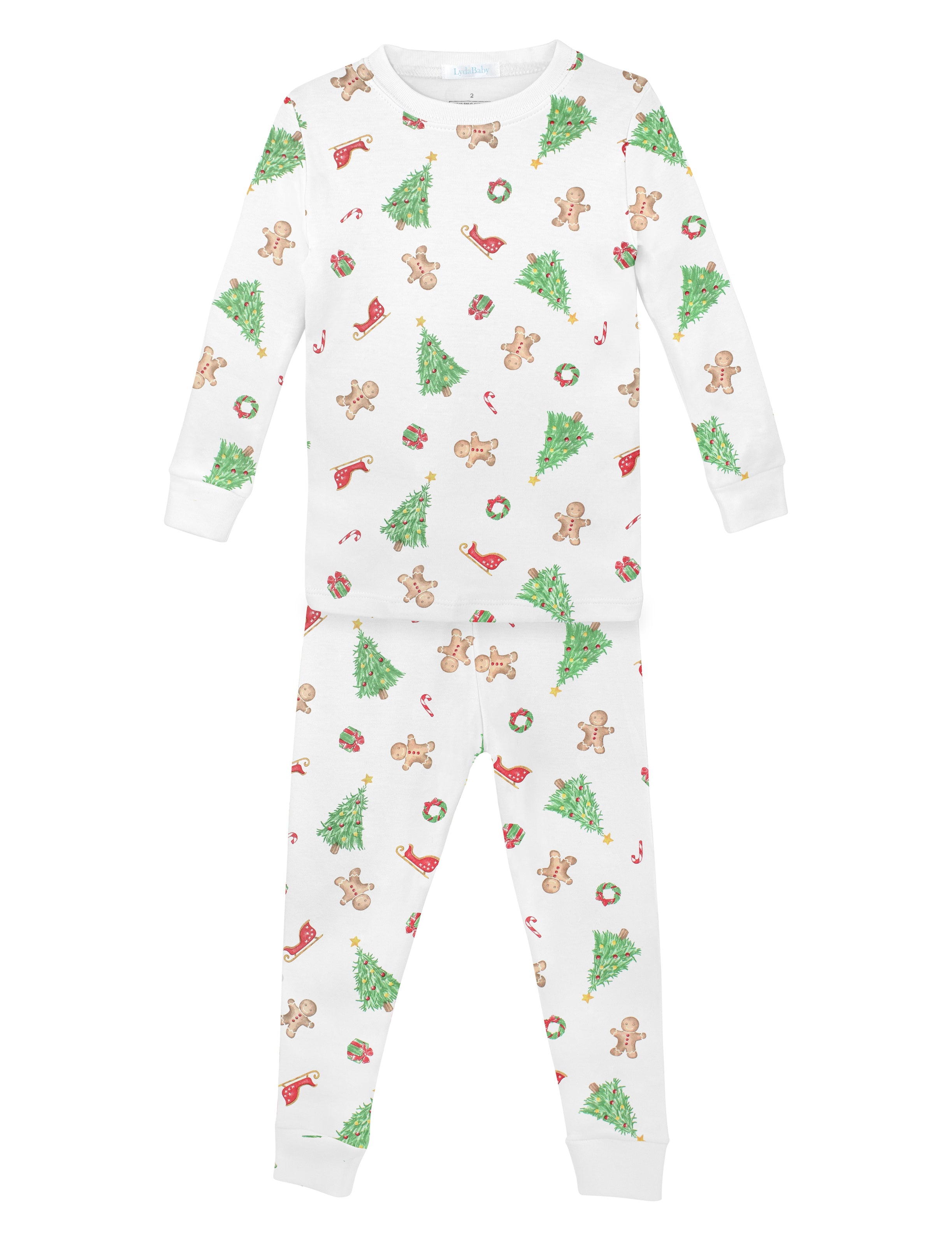 Luxury unisex baby Christmas pajama set in Peruvian Pima cotton with holiday print of trees, gingerbread cookies, candy canes, gifts, and Santa’s sleigh