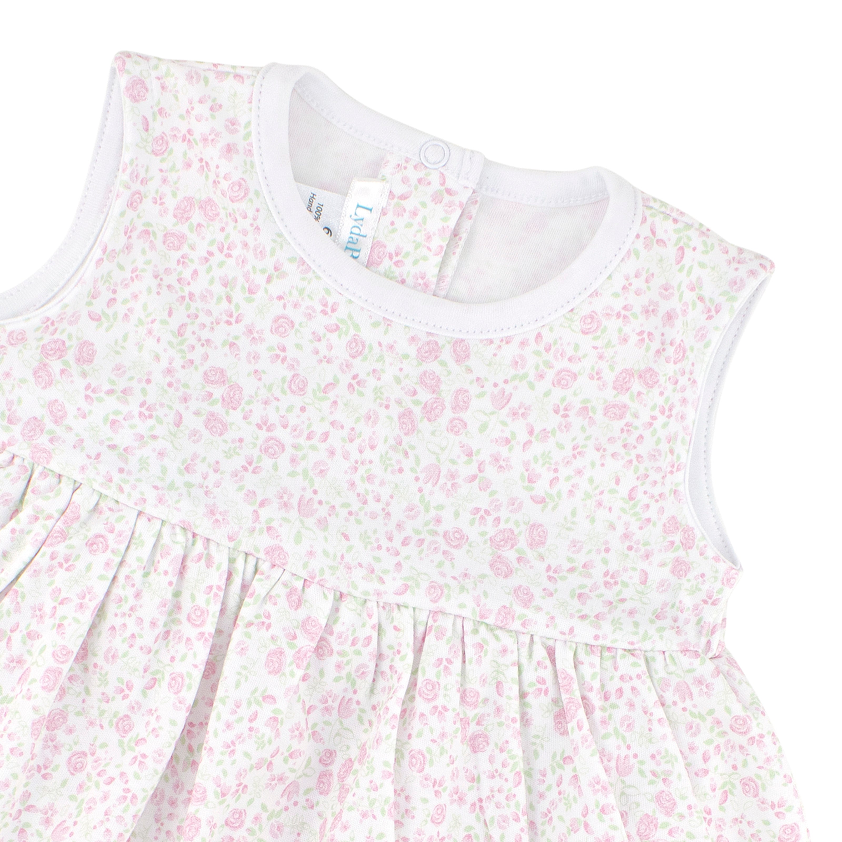 Sleeveless baby girl dress with tiny pink floral print made from soft Peruvian Pima cotton.