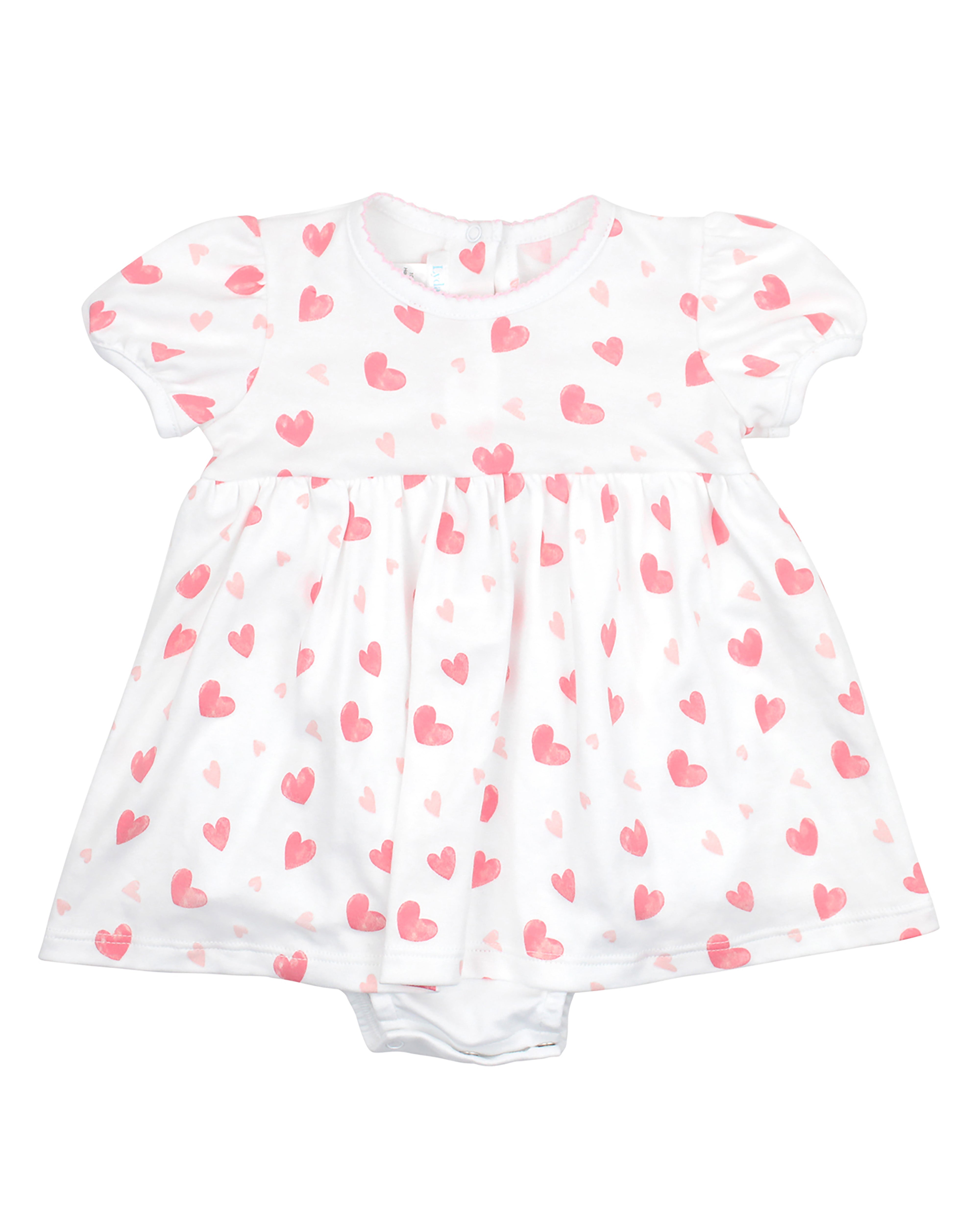 Baby girl dress with allover watercolor hearts print and round neckline with stitched detail — made from ultra-soft Peruvian Pima cotton for breathable comfort and everyday sweetness.
