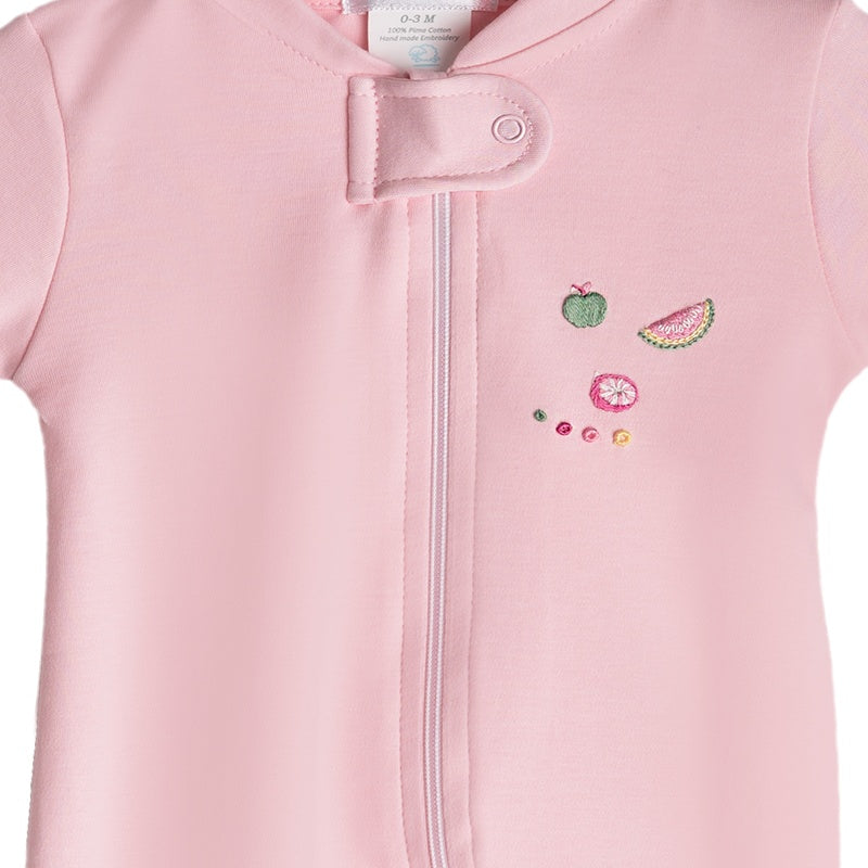 Pink pima cotton baby girl footie with hand embroidered summer fruits - close up